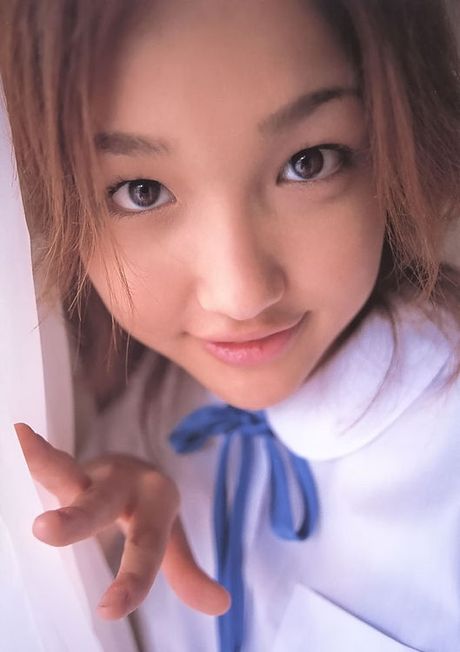 Cute little asian school girl showing her body off in a bikini