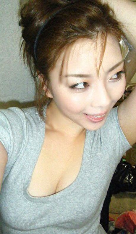 Japanese girlfriend bitting sexily on a strawberry