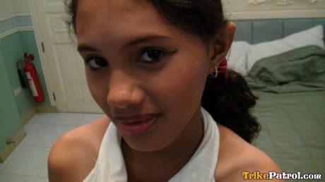 Asian amateur Angel strips and shows her hot butt and tits in a solo