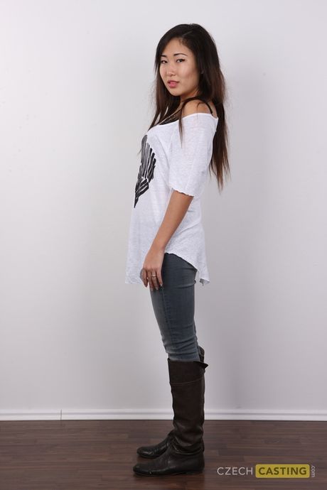 Asian teen Mira strips and shows her amazing boobs and hairy cunt in a solo