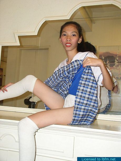 Amateur Asian girl strips and shows her tiny tits and pussy