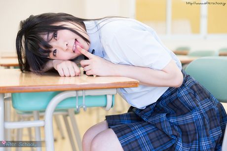 Asian schoolgirl Minano Ai strips and shows her sexy booty and tits