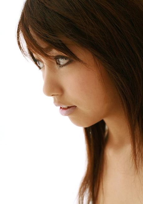 Skinny Japanese babe Rika Yuuki strips and shows her perfect ass