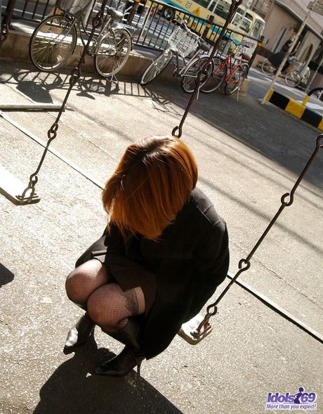 Sexy Asian babe Yoko strips and shows her tiny tits and hot ass