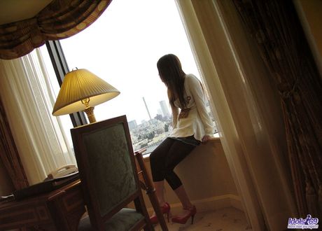 Superb Asian babe Shiori strips to her pantyhose and shows her hot ass